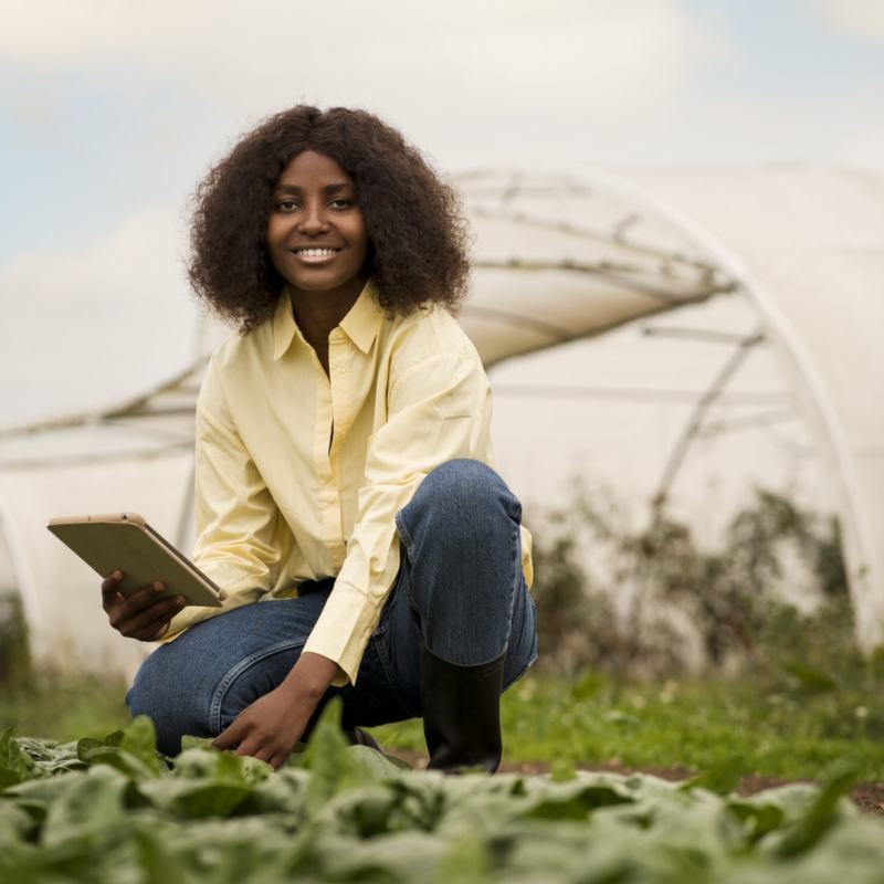 full-shot-smiley-woman-holding-tablet